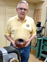 Bob is holding one of his winning entries.