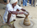 Nepal man makes drinking cups.