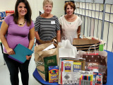 Members of the Wisconsin Club and After Schoolers Club donate bags of school supplies to Borman Elementary School.