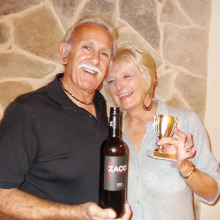 Wayne and Pam Casalino show off their winning wine and the traveling trophy for Tuesday Tasters.