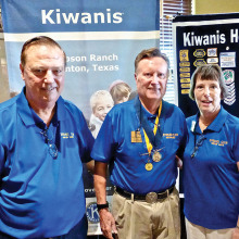 Dick Anderson with his wife Barbara receiving his Kiwanian of the Year award from Dave Everly, past-president of Kiwanis.