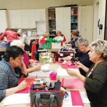 Sassy Stampers busy at work on Christmas Gift Bags.