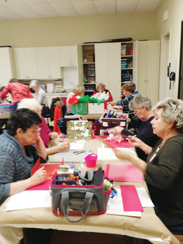 Sassy Stampers busy at work on Christmas Gift Bags.