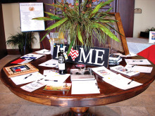 Table with Americana items immediately inside the clubhouse entrance.
