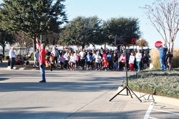 Fred Thompson of the Living Well Committee gives the 5K participants the signal to start. Photo courtesy of Jerry Schlesinger