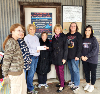 Community Clothes Closet volunteers with Mala Bowdouris presenting check to Gwen St. Clair, Director.