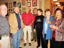 Left to right: Mike Aramanda, Alfred Wright, Pete Toppan, Kathy Perry, Millie Aramanda, Cherie Snowden and Rupa Mathur gather for a holiday toast.