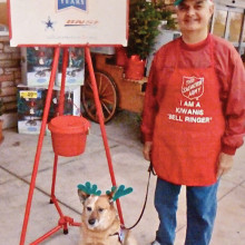 Art Masciere and his dog, Cody, ringing the Salvation Army bell.