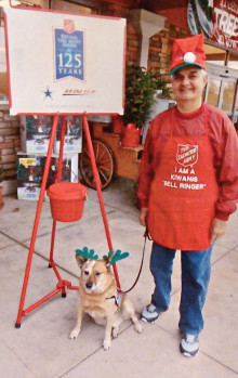 Art Masciere and his dog, Cody, ringing the Salvation Army bell.