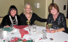 Cheri Hamilton, Ginny Brady and Maureen Schreiber shared champagne and their Christmas wish lists at the table.