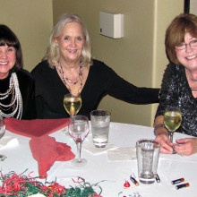 Cheri Hamilton, Ginny Brady and Maureen Schreiber shared champagne and their Christmas wish lists at the table.