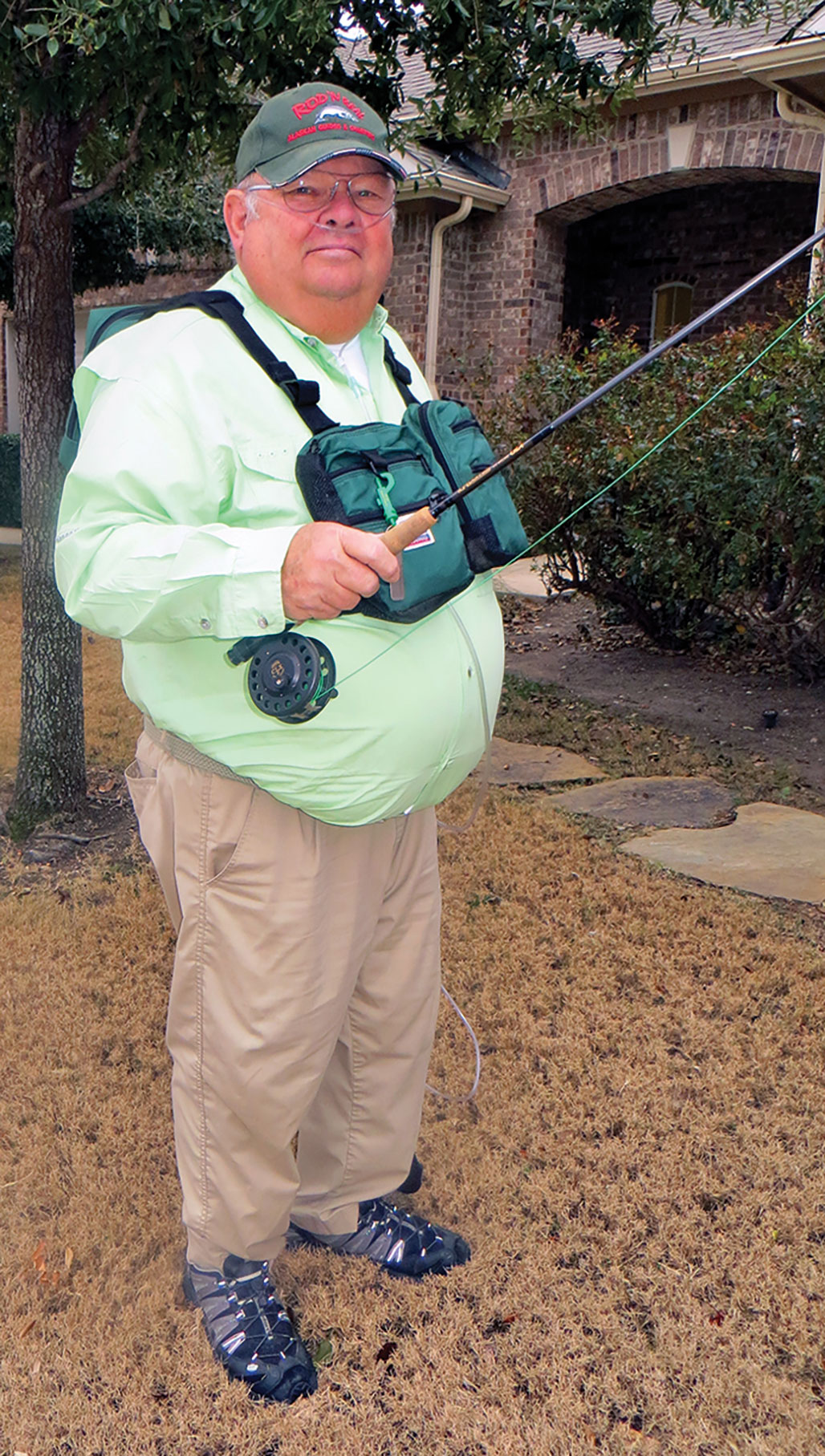 Dick Farnsworth with his fly fishing rod, reel and gear. – Robson