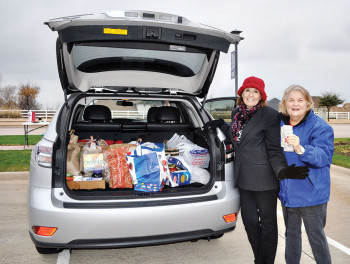 Donna Chabot and Liz Dinkins collect canned food, money and non-perishable items for Denton Community Food Bank.