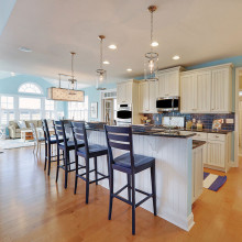 Coastal Casual: The combination of the bead board panel from the cabinets and wall paint color gives this casual kitchen a coastal feel. This causal design makes for a comfortable environment.