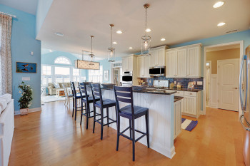 Coastal Casual: The combination of the bead board panel from the cabinets and wall paint color gives this casual kitchen a coastal feel. This causal design makes for a comfortable environment.
