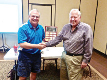 Mark Musgrove, Woodworker of the Year, is being congratulated by our current president, Joey Misiaszek.