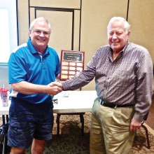 Mark Musgrove, Woodworker of the Year, is being congratulated by our current president, Joey Misiaszek.