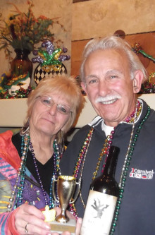 Pam and Wayne Casalino make a clean sweep at the Tuesday Taster’s Mardi Gras celebration. They chose the winning wine and Pam found the baby in the King Cake!
