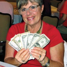 Maureen Lehrer is proudly displaying her winnings. Photo by Vicki Baker