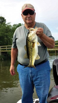 Dick Dauphinais showing the bass he caught