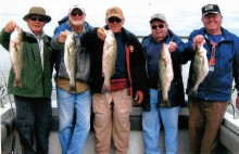 Left to right: Norbert Kronland, Larry Walker, Bob Pervsse, Buddy Beauvis and Jim Galbraith showing off some of their fish.