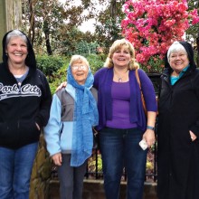 Judy Harris, Barbara Roberts, Susan Parker and Geils Hegranes touring azalea gardens in the rain.