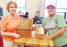 Sue Reber and JoAnn Bostwick with boxes made in our wood shop.