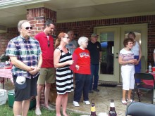 Marguerite Richardson leads guests in singing God Bless America.