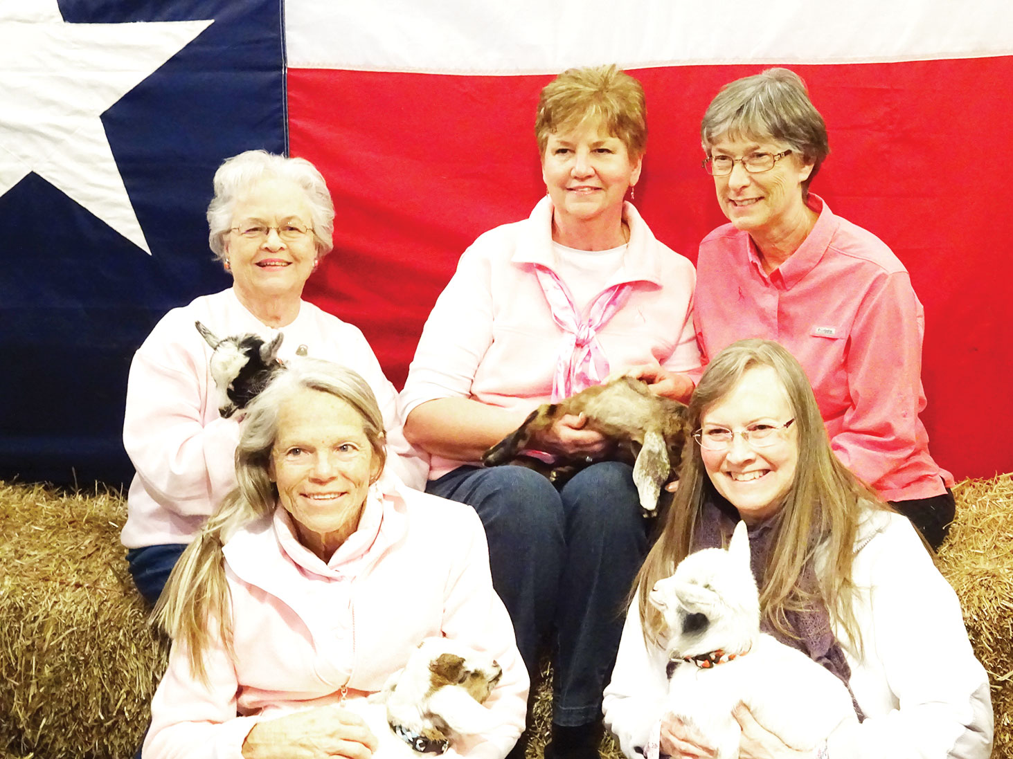 Holding baby goats, back row: Melba Beckham, Nancy Thomas, Cathy Harden; front row: Christine Kidder and Jill SanMiguel
