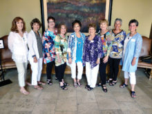 Ready to serve the new travel year: Joyce Frey, Phyllis Ayers, Gayle Coe, Bert Zeitlin, Peggy Crandell Duff, Pat Thompson, Jan Wallace, Susan Hebert and Vicki Baker