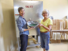 President Judie Smothers and Vice President Colleen Jordan unload a kiln.