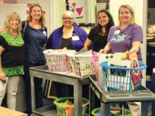 Dorothy pointer presents the gift to Cook Children’s Hospital staff. Jillian Mitchell, Community Program Coordinator, expressed her written thanks for the gift.