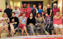 Baseball Fans, front row: Susan and Sadie Parker, Millie Aramanda, Melodye Rogers, Kathy Heberlein, Vickie Bone, Nancy Toppan and Kathy Zumann; back row: Ed Heberlein, Mike Aramanda, Bobby Rogers, David Parker, Tom Zumann, Jere Bone, Viv Wright, Al Wright and Pete Toppan.