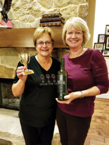 Cindi Stampf and Janie Farnsworth with the winning wine.