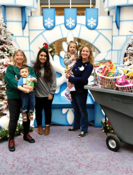 Presentation of the toys by Dorothy Pointer, her grandson Crosby, Cook Children’s Christmas Elf Dyani Merkley, Dorothy’s daughter and granddaughter Keilee