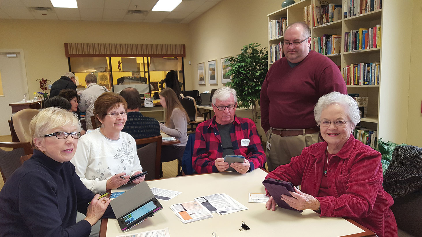 Kindle users in various stages of mastering their Kindles. Melba Beckham looks especially proud that she is ready to read digitally! Mary Robde, Rae Kimmel, John Fernandes, Denton librarian Jess Turner and Melba Beckham.
