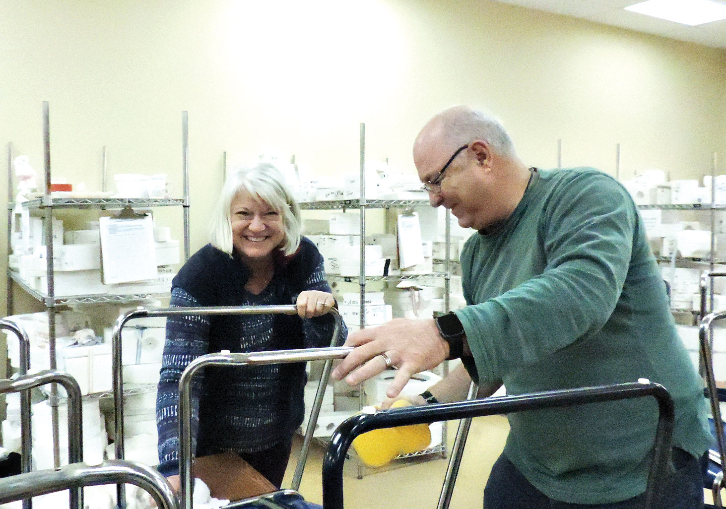 Mary and Ken Arthur enjoy washing tables and chairs.