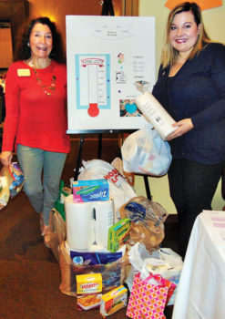 Judy Ondina, Service, and Randi Skinner, Friends of the Family, with donations from members
