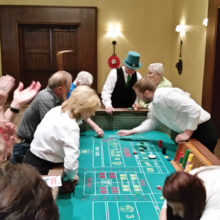 Ken Kruzel (in the big green Irish hat!) getting ready to roll the dice in Craps