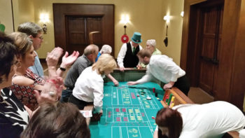 Ken Kruzel (in the big green Irish hat!) getting ready to roll the dice in Craps