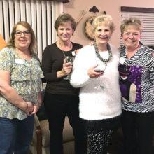 Joyce Brein, hostess, Linda Phillips, Wanda Lock and Cheryl Lubojacky toast the new year of Potluck.