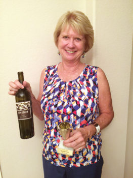 August winner Cyndi Stampf with a 2015 Red Blend from Cocobon Estates