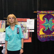 Judy Hilderbrand and her winning quilts