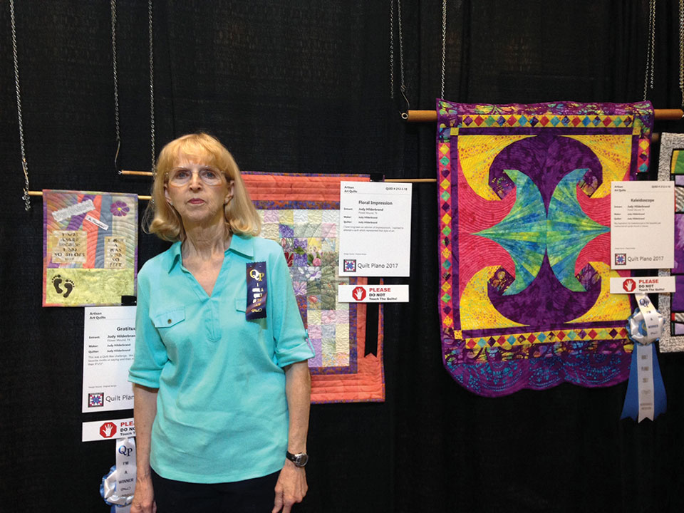 Judy Hilderbrand and her winning quilts