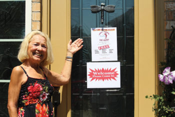 Mary Beninato displaying Victoria’s welcome door