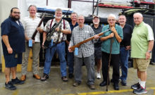 Left to right: “Poochie” (Shilen tour guide), Russ Bafford, Andy Cartwright, Stephen Pettigrew, Dave MacDonald, Kelly Petre, Ed Schmidt, Larry Hampton and Dick Remski