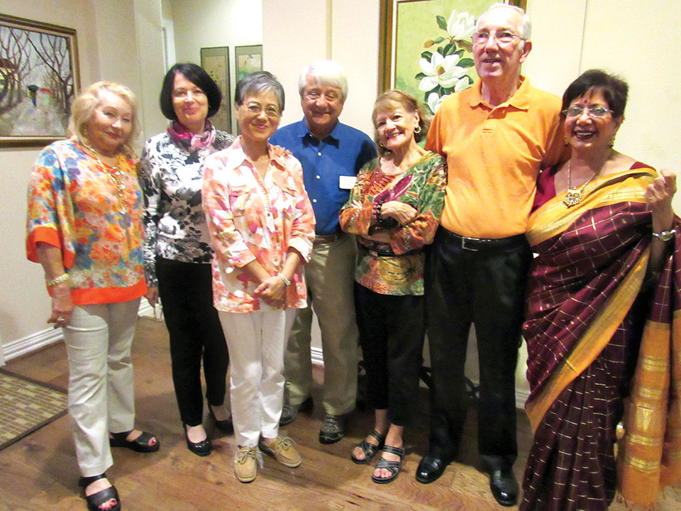 Salette Ogren, sunshine person from Brazil; Marie-Christine Koop, president from France; Jennie Chiang; treasurer from Hong Kong; Fred Van Naerssen, past president from Netherlands; hosts Stella and Ken Smith; and Rupa Mathur, vice president from India.