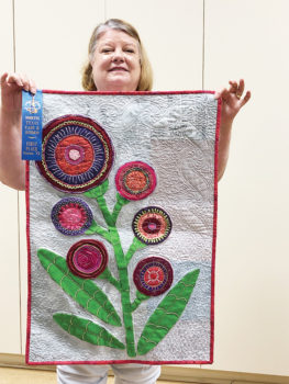 Lucy Rees, flower applique quilted wall hanging