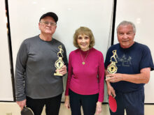 Arlene Pfeil (center) with the winners of 2019 Arlene Pfeil/Jim Greg Doubles Tournament Jim “Butch” Southard and Peter Hollatz