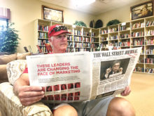 Robson residents enjoy sitting and reading the Wall Street Journal and four other publications sponsored by the Friends of the Library.